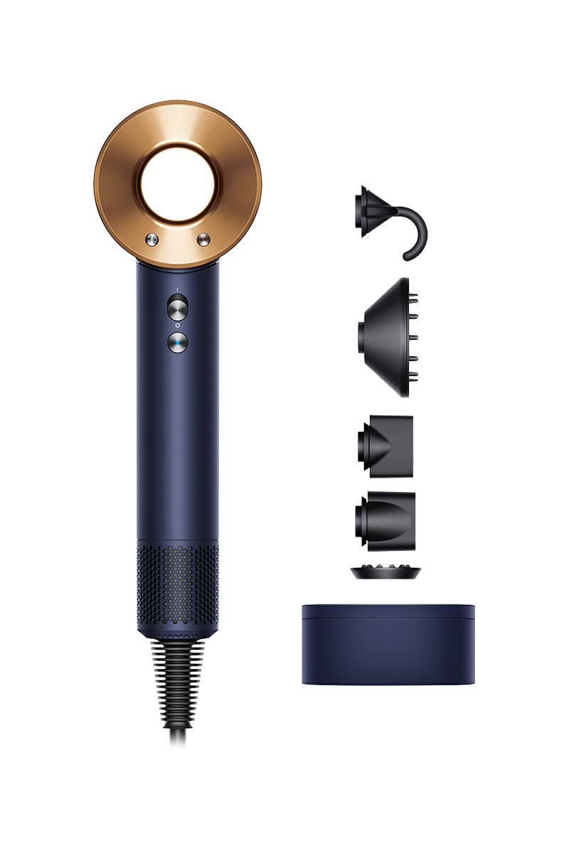 This image shows a navy and gold hairdryer along with various attachments displayed beside it. The attachments include a curl-enhancing hook, a diffuser for even airflow, a concentrator nozzle for precise styling, and other tools to customize hair drying and styling. The set also features a compact storage case, ensuring that the components are organized and easily Dysonible. The design emphasizes both functionality and elegance, appealing to those who value a premium styling experience.